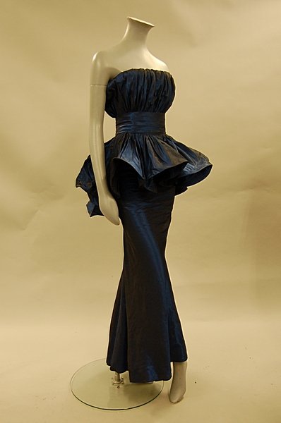 A changeable-blue taffeta evening gown, attributed: A changeable-blue taffeta evening gown, attributed to Antony Price, late 1980s-early 1990s, unlabelled, with strapless bodice, flounced graduated peplum, cummerbund, bust 81cm, 32in, waist 61cm, 24in