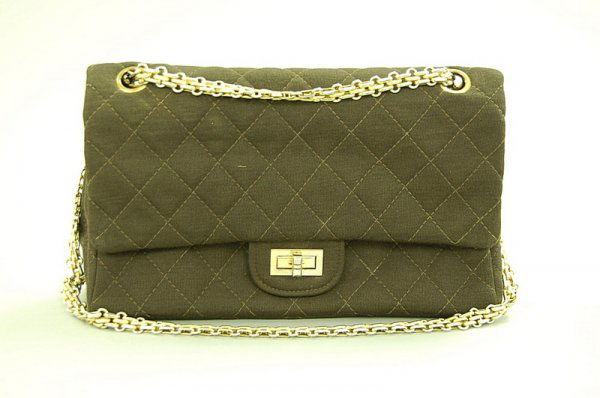 A Chanel brown jersey quilted bag, 1960s, with gilt: A Chanel brown jersey quilted bag, 1960s, with gilt stamp to the interior, gilt chain and hardware, 25cm, 10in long