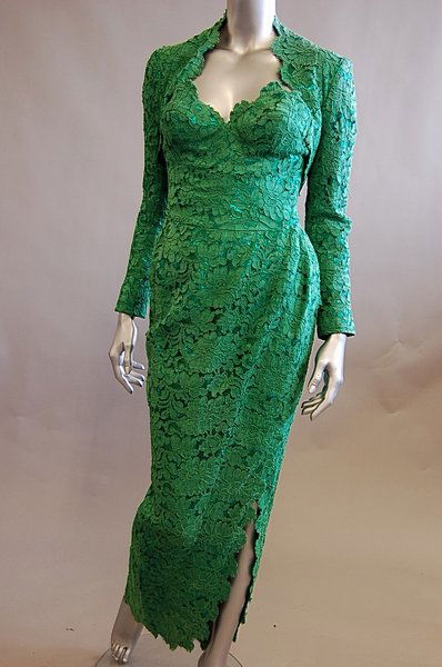 An Antony Price green lace evening gown and jacket,: An Antony Price green lace evening gown and jacket, 1990s, labelled, comprising green lace sheath and matching bolero jacket, with corsetted strapless bodice over figure-hugging skirt with side slit,