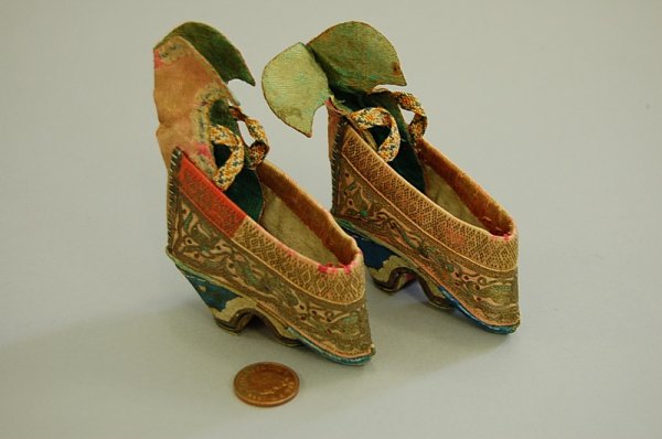 A pair of tiny lotus-bud slippers for bound feet,