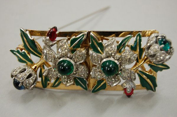 A pair of Mazer Brothers enamelled and jewelled c: A pair of Mazer Brothers enamelled and jewelled clips with brooch attachment, American, 1940s, un-signed, with cabochon red and green stones, green enamelled leaves, with an optional detachable brooch
