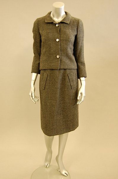 A Balenciaga couture steel-grey wool suit, Winter: A Balenciaga couture steel-grey wool suit, Winter 1965, Paris label, no.95210, fastened by three pearlised buttons, lined in grey silk, slim skirt with two pockets, chest 96cm, 38in, waist 71cm, 28in,