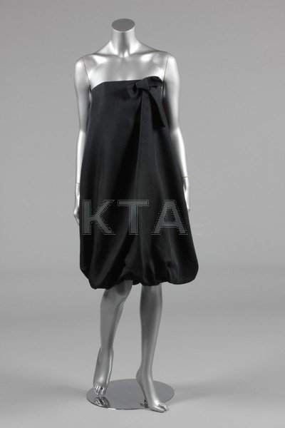 A Balenciaga Le Dix black gazar cocktail dress, late: A Balenciaga Le Dix black gazar cocktail dress, late 1980s, labelled and size 40, strapless, with integral corset, large bow to the front, balloon-skirt, bust 86cm, 34in
