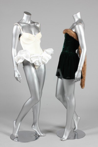 A group of mainly 1980s evening-wear, including an: A group of mainly 1980s evening-wear, including an unlabelled green velvet dress with mink trim, possibly Antony Price; an unlabelled black Odicini gown with taffeta waterfall pleats to front; an unla