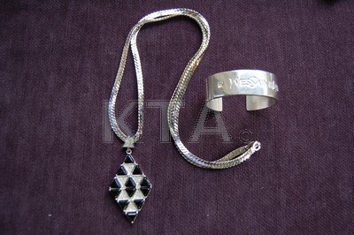 An Yves Saint Laurent silver-plated bangle, together: An Yves Saint Laurent silver-plated bangle, together with a Christian Dior necklace with lozenge pendant inset with diamante, in box (3)