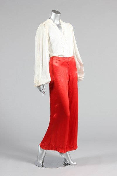 A group of 1970s eveningwear, comprising Thea Porter: A group of 1970s eveningwear, comprising Thea Porter white cotton blouse, red satin flares and red chiffon dress; two Radley moss crepe dresses in yellow (unlabelled) and blue; and a Jean Varon red an