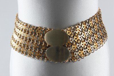 A Paco Rabanne chainmail belt, 1960s, with metal label: A Paco Rabanne chainmail belt, 1960s, with metal label to the reverse, of gold and silver links with brushed metal buckles, 86cm, 34in long