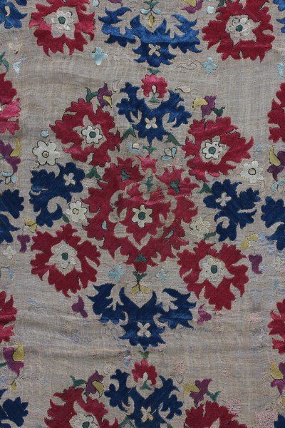 An embroidered sash, Algerian, Ottoman, 18th century,: An embroidered sash, Algerian, Ottoman, 18th century, of fine buff muslin, embroidered in mainly reds and blues with large foliate palmettes, repeats, 42 by 244cm Exhibited at the Museum for Islamic A