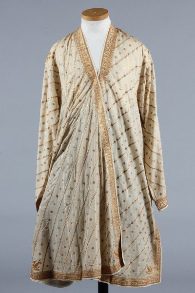 A gold embroidered lawn surcoat, Indian, mid 19th: A gold embroidered lawn surcoat, Indian, mid 19th century, finely worked in couched gold threads with botehs and hearts to rear shoulders, the main ground similarly worked with gold rosettes and diago