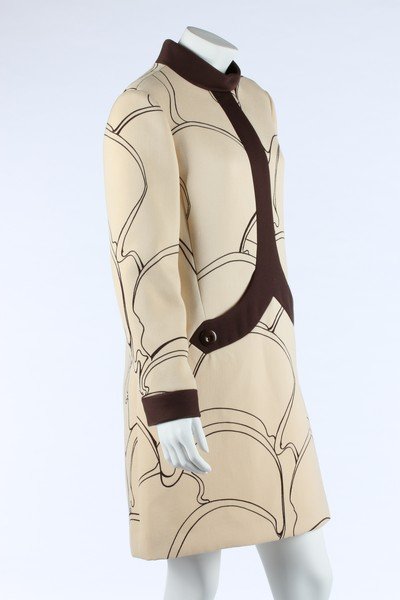 A Pierre Cardin printed wool mini-dress, 1969, labelled: A Pierre Cardin printed wool mini-dress, 1969, labelled Paris & New York, with contrasting brown collar and curved pocket bands with two buttons, printed with organic abstract forms, bust 97cm, 38in L