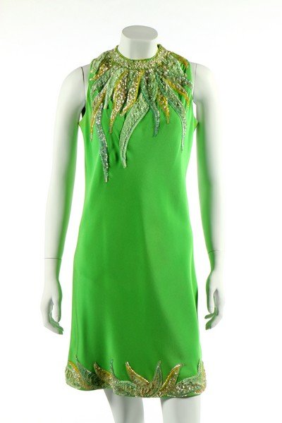 A Pierre Cardin couture apple-green sequined silk: A Pierre Cardin couture apple-green sequined silk crêpe cocktail dress, 1967, black on white Paris label, of Abrahams silk crêpe, the neckline and hem appliquéd and embroidered by Jean-Guy Vermont 