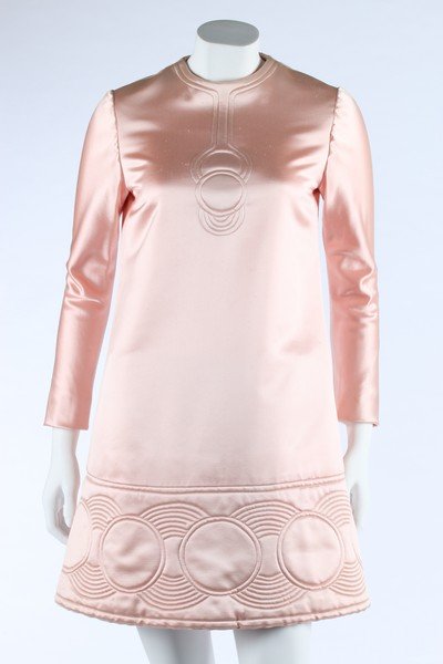 A Pierre Cardin quilted rose-satin mini-dress, 1969,: A Pierre Cardin quilted rose-satin mini-dress, 1969, labelled Paris & New York, of Abrahams satin, quilted with a futuristic 'necklace' motif to the bodice, the hem with circular repeats, bust 92cm, 3