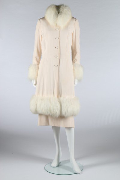 A Cazaubon/Dudel for Chanel couture ivory silk crêpe: A Cazaubon/Dudel for Chanel couture ivory silk crêpe dress and matching fox trimmed evening coat, 1974, labelled and numbered 51999, comprising: simple slip-style dress, the coat with quilted silk li