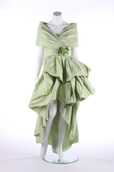 A Karl Lagerfeld for Chanel couture shot pale: A Karl Lagerfeld for Chanel couture shot pale green-grey taffeta silk evening dress, circa 1990, large black on white woven label and 69565, with integral corset, the skirt cut short at the front and 