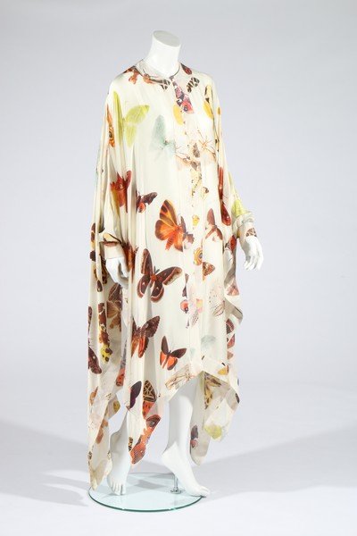 An Alexander McQueen moth print satin kaftan,: An Alexander McQueen moth print satin kaftan, pre-collection Spring-Summer, 2007, label dated 2006, size 40 and with shop tags, button closure to front, inset cuffs to the side panels, with top-stitch
