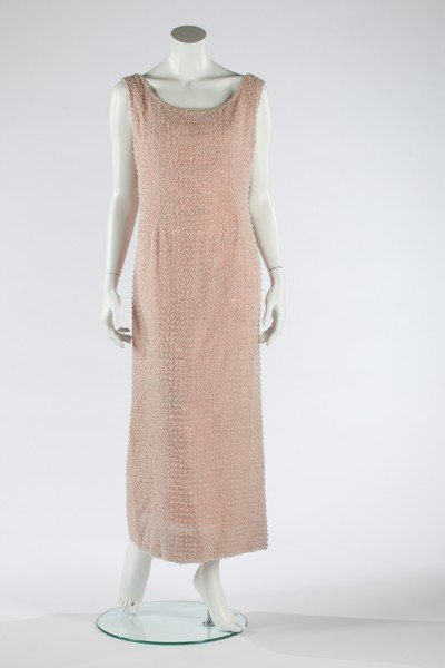 A Guy Laroche couture pink beaded sheath, circa 1960.: A Guy Laroche couture pink beaded sheath, circa 1960. Paris labelled and numbered 8247, entirely covered in a lattice of pale pink seed beads with white beaded cluster centres, bust 92-97cm, 36-38in