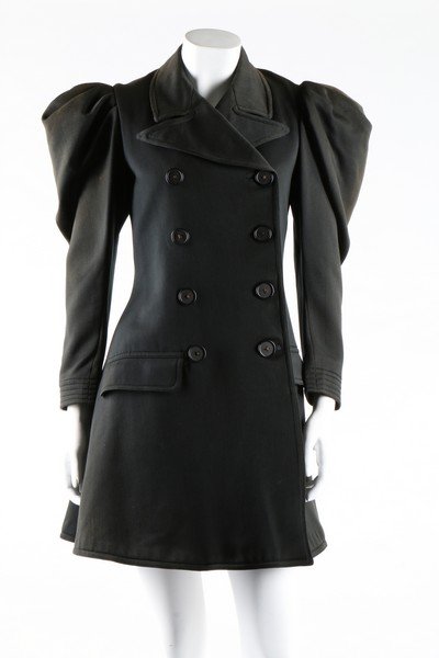 A woman's double breasted day jacket, circa 1895.: A woman's double breasted day coat, circa 1895. of black wool; together with a 1920s grey wool riding jacket, pair of jodphurs and a 20s knitted silk swimming costume (4)