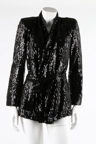 A group of mainly black evening-wear. including: A group of mainly black evening-wear. including Katharine Hamnett Tuttabankem black sequined jacket, 1980s; Nettie Vogues long black sequined dress, 1960s; a Guy Laroche Paris pret a porter black sati