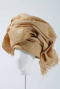A Philip Treacy woven raffia turban hat, designed for: A Philip Treacy woven raffia turban hat, designed for the Rifat Ozbek collection, 1991. 28cm, 11in high
