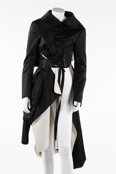 A Comme des Garcons shot blue-black satin three sleeved: A Comme des Garcons shot blue-black satin three sleeved coat, Autumn-Winter, 2004. gold and black woven label, size M, with hook and eye corsetry style front fastening, asymmetric low-set left sleeve,