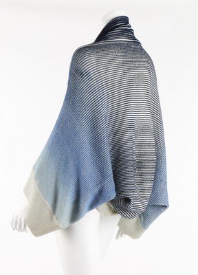An Issey Miyake knitted 'Shell' jacket, 1984, grey and: An Issey Miyake knitted 'Shell' jacket, 1984, grey and black label, the rib-knit in shades of light to dark midnight blue, with circular collar and hem band knitted in one, low-set kimono-like sleeves