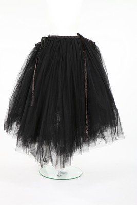 A Comme des Garcons black tulle ballerina skirt,: A Comme des Garcons black tulle ballerina skirt, Autumn-Winter, 1995, Noir labelled, with petersham and satin ribbons which tie at the front On the catwalk this was worn with a simple crop-top.