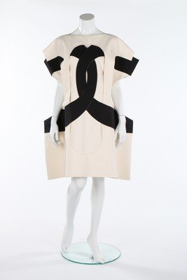 A Rei Kawakubo/Commes des Garcons black and white: A Rei Kawakubo/Commes des Garcons black and white calico pinafore dress, Spring-Summer, 2014, printed ribbon label, with dramatic black symbol appliqued and interwoven through the sleeves, attached to