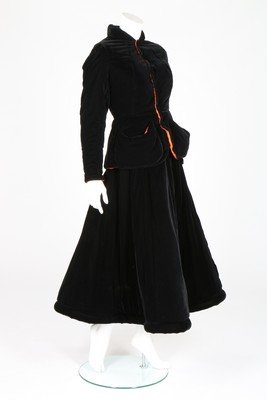 A Jean-Paul Gaultier black velvet evening ensemble,: A Jean-Paul Gaultier black velvet evening ensemble, 1990s, Femme labelled, UK size 10, the ball gown with padded hem and large metal zips to hips and rear closure; the matching jacket with contrasting