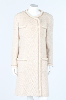 A Chanel beige and ivory silk/wool tweed coat, circa: A Chanel beige and ivory silk/wool tweed coat, circa 2000, labelled, with side fastening and concealed CC buttons; together with a grey/beige wool tweed short jacket with CC buttons to the breast pock