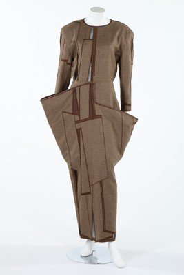 A fine Anne-Marie Beretta brown wool dress with: A fine Anne-Marie Beretta brown wool dress with abstract panels, circa 1980, labelled, with abstract geometric embroidered panels inset with transparent gauze, the trapezoid skirt with deep, wide pock