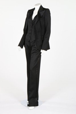 An Yves Saint Laurent, Rive Gauche 'Le Smoking' evening: An Yves Saint Laurent, Rive Gauche 'Le Smoking' evening suit, labelled Rive Gauche, size F36, comprising; jacket with wide satin lapels, waistcoat, trousers, knee length skirt, bust 86cm, 34in, waist