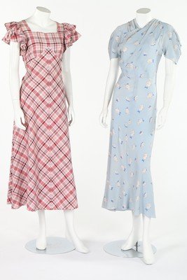 Summer-wear, 1930s-40s, comprising: printed pale blue: Summer-wear, 1930s-40s, comprising: printed pale blue crepe de chine bias cut garden party gown, emerald silk blouse with large buttons, white cotton shorts; a pink plaid cotton dress with flounced sl