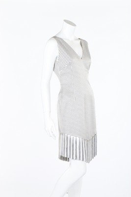 A Givenchy couture chequered silk cocktail dress, 1998,: A Givenchy couture chequered silk cocktail dress, 1998, couture labelled, with fringed and knotted hem; together with a xerox of a similar dress being modelled on the catwalk, bust 92cm, 38in; and a J