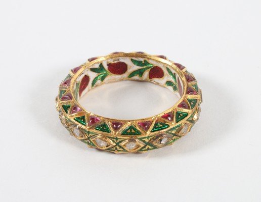 An Indian gold and enamel man's ring, inset with: An Indian gold and enamel man's ring, inset with diamonds, rubies and emeralds, size S 1/2; together with a pair of Indian enamelled domed cuff-links with seed pearl centres; and gilt coin-like cuff-l