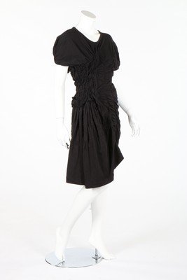 A Comme des Garcons black shirred cotton jersey dress,: A Comme des Garcons black shirred cotton jersey dress, Spring-Summer, 1990, labelled and dated 1989, with irregular ruching and gathering, the elasticated shirring running in different directions, bus