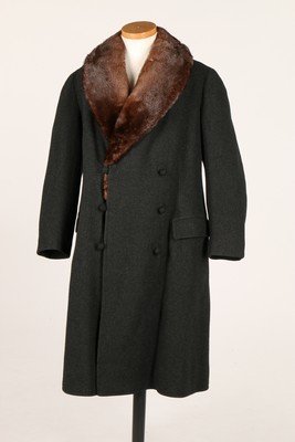 A mink lined dark grey wool man's coat, 1920s, labelled: A mink lined dark grey wool man's coat, 1920s, labelled 'Hermann Hoffmann Berlin', double-breasted, chest 112cm, 44in Hermann Hoffmann produced men's tailoring, outerwear and sports wear and is featur