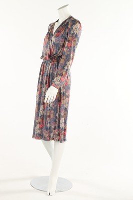 A group of Missoni clothing, comprising printed silk: A group of Missoni clothing, comprising printed silk jersey wrap-over dress; knitted striped cape with cowl neck; knitted zip up cardigan with colourful zig-zag design; and a black and white printed s