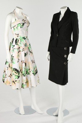 A Wendy Dagworthy black gabardine skirt suit,: A Wendy Dagworthy black gabardine skirt suit, Autumn-Winter, 1973, black on white label, with pleated satin trim, with matching red crepe blouse; together with a Hawaiian-print gabardine top, floral p