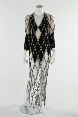 A dance/cabaret dress, 1970s, the skirt made entirely: A dance/cabaret dress, 1970s, the skirt made entirely from a diamond-pattern web of silver sequins, rhinestones and large droplets, bust approx 91cm,36in, hips approx 91cm,36in