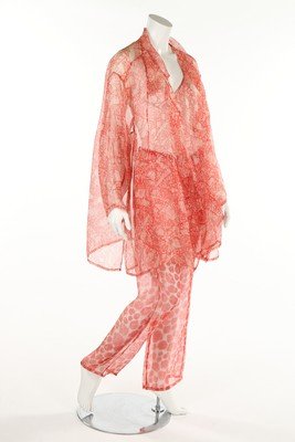 An Issey Miyake red and white batik printed organza: An Issey Miyake red and white batik printed organza jacket and trousers, Spring-Summer, 1985, grey and black labels, together with a Miyake black lurex wrap jacket, c.1990 (3) The models Iman and Pat 