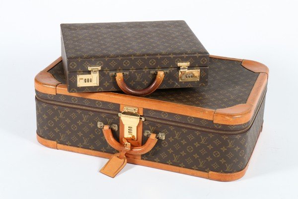 A Louis Vuitton monogrammed hard-sided suitcase, with (1 of 9)