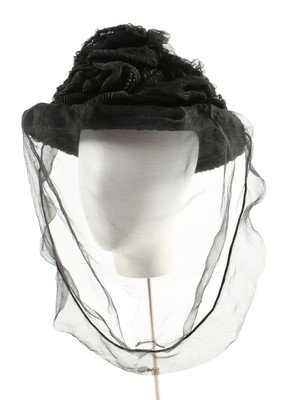 A Robert Heath mourning bonnet, believed to have: A Robert Heath mourning bonnet, believed to have belonged to Queen Victoria, circa 1890, the satin lining printed with royal appointment mark 'To Her Majesty the Queen and the Royal Family, Robert Hea