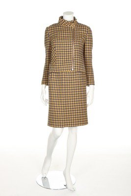 A good Pierre Cardin blue and yellow hound's tooth: A good Pierre Cardin blue and yellow hound's tooth checked wool suit, 1966, labelled 'Exclusively designed by Pierre Cardin, Paris' and size 14, the jacket with large brass zip, single pocket, matchin