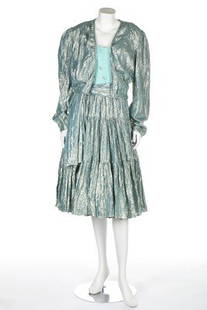 A Thea Porter silver/gold lame evening ensemble, early: A Thea Porter silver/gold lame evening ensemble, early 1980s, Couture labelled, the dress with turquoise chiffon boned bodice, flounced skirt, with matching sash and bolero jacket, bust 86cm, 34in;