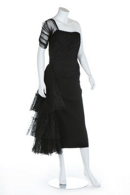 A Gilbert Adrian black crepe and tulle dress trimmed in: A Gilbert Adrian black crepe and tulle dress trimmed in Chantilly lace, early 1950s, labelled, bust 86cm, 34in, waist 66cm, 26in