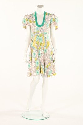 An Ossie Clark/Celia Birtwell printed cotton-viscose: An Ossie Clark/Celia Birtwell printed cotton-viscose sun-dress, 1972, un-labelled, with printed pink, jade green and chartreuse lattice and flower patterns, low neck, wrap-around skirt with ties, bust