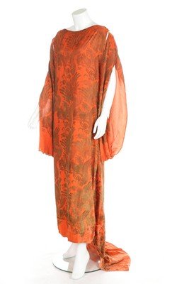 A Maria Gallenga gothic-stencilled tabard dress, mid: A Maria Gallenga gothic-stencilled tabard dress, mid 1920s, un-labelled, of deep orange velvet, stencilled with mythical birds and beasts, the shoulders and sides outlined and weighted with glass bead