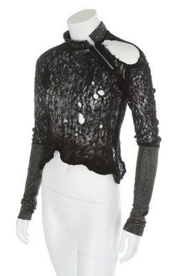 A rare Westwood/McLaren 'Sex Original' black mohair and: A rare Westwood/McLaren 'Sex Original' black mohair and vinyl sweater, circa 1975, woven pink label, with studded vinyl collar, diagonal zip, vinyl lower sleeves with thumb covers, intentional holes t