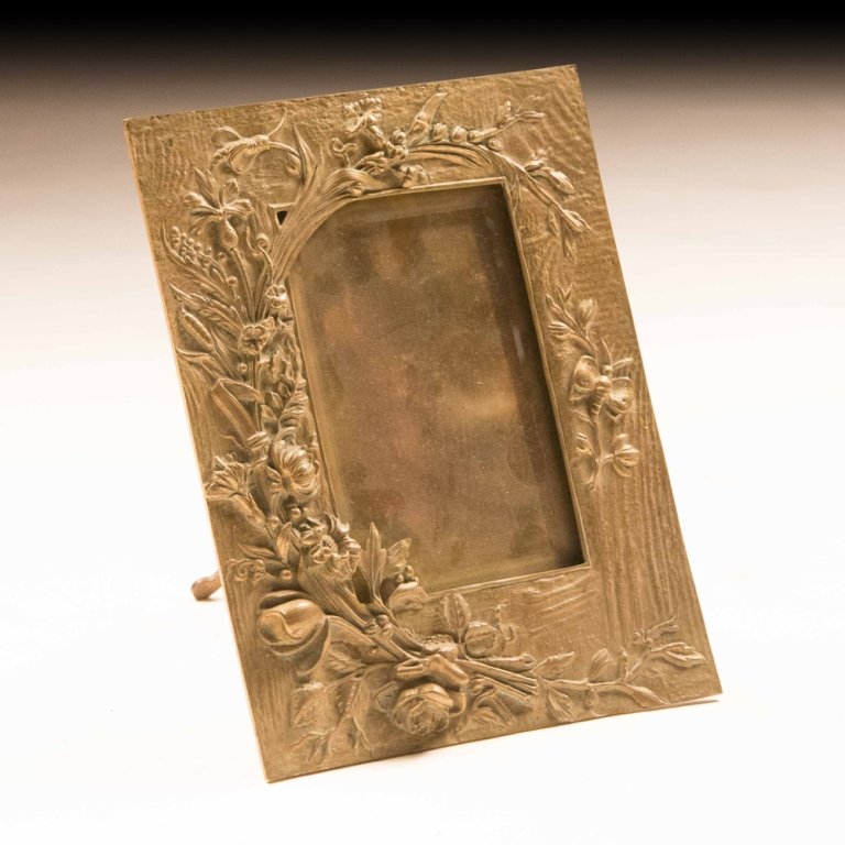 Early 20th Century Art Nouveau-style Table Frame: This early 20th century Art Nouveau-style table frame is made of brass and is intricately decorated. Measures 11 x 9 inches