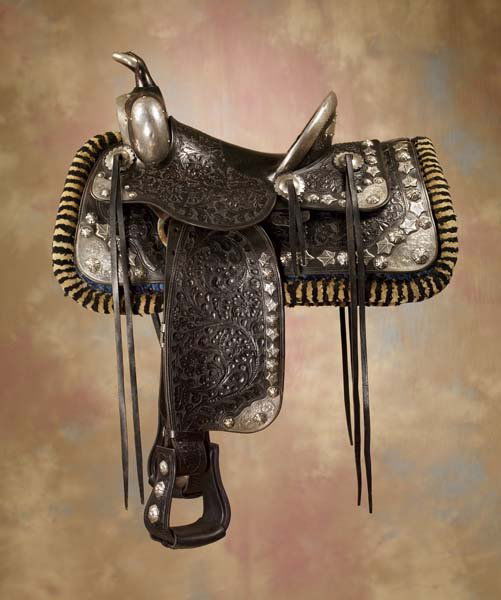 Edward H Bohlin The Pasadena Silver Parade Saddle: Elegant, floral carved, black, 1930s Hollywood, California sterling silver parade saddle built on a Miles City Tree with, 14" seat, 5" high silver trimmed cantle with engraved silver plate on the back